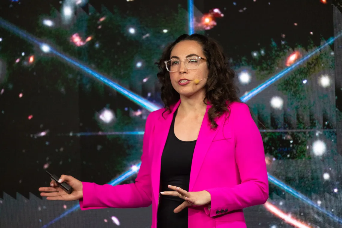 Erika Hamden in front of a field of stars