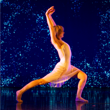 Photo of a dancer against a luminescent backdrop
